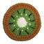 A crocheted kiwifruit slice coaster or decorative piece featuring concentric rings of brown, green, white, and dark brown seeds on a plain white background.