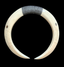 An off-white carved bone or horn collar with geometric patterns and a dark gray wrapped section at the top, shown against a solid black background.