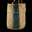 A greenstone carving of a Toki and Mask with paua eyes displayed on a woven kete bag.