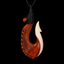 Carved bone fish hook pendant on a black background