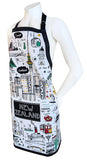 A white apron with black straps and black border, decorated with colorful New Zealand-themed illustrations including the Sky Tower, cable cars, and a 'New Zealand' sign, displayed on a white mannequin torso against a white background.