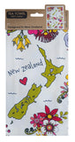 A packaged cotton tea towel featuring a colorful New Zealand map design with flowers, birds, and the words 'New Zealand' on a white background. The header card shows 'TEA TOWEL 100% cotton' and a small inset of the reverse pattern.