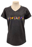 Black t-shirt with colourful bird design on a mannequin against a white background