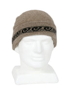 Beige beanie with patterned band on a mannequin head against a white background