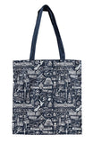 A navy blue tote bag with a detailed white toile-style print of architectural landmarks and figures, featuring two dark navy shoulder straps, shown against a plain white background.