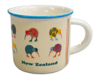 A cream-colored enamel mug with a blue rim, decorated with colorful kiwi birds and the text 'New Zealand' on the front.