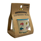 New Zealand Espresso Mug in its original brown kraft paper gift packaging, featuring a white ceramic mug with colorful kiwi bird illustrations and a blue rim.