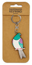 Bird-shaped keychain on a brown card with 'Handmade Keyring' text