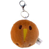 A brown plush bird keychain with a yellow beak, dark brown embroidered eyes and feet, attached to a silver metal clasp and key ring. A small white tag with the brand name 'berek' is visible on the right side.