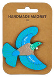 Handmade bird-shaped magnet on a brown backing card with 'Handmade Magnet' text.