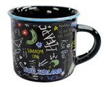 A black enamel mug with a light blue rim, decorated with colorful hand-drawn doodles and the words 'NEW ZEALAND' in blue. The mug is photographed on a clean white background.