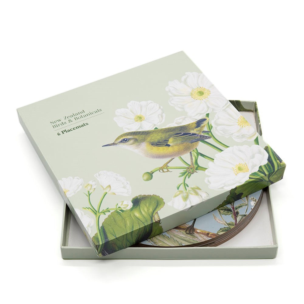 Set of New Zealand Birds & Flora placemats in a box with illustrations of birds and flowers.