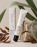 Wild Ferns lip care product with packaging on a natural background