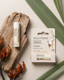 Wild Ferns lip balm with packaging on a natural background