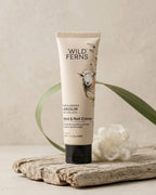 Tube of Wild Ferns hand and nail crème on a wooden surface with a natural background
