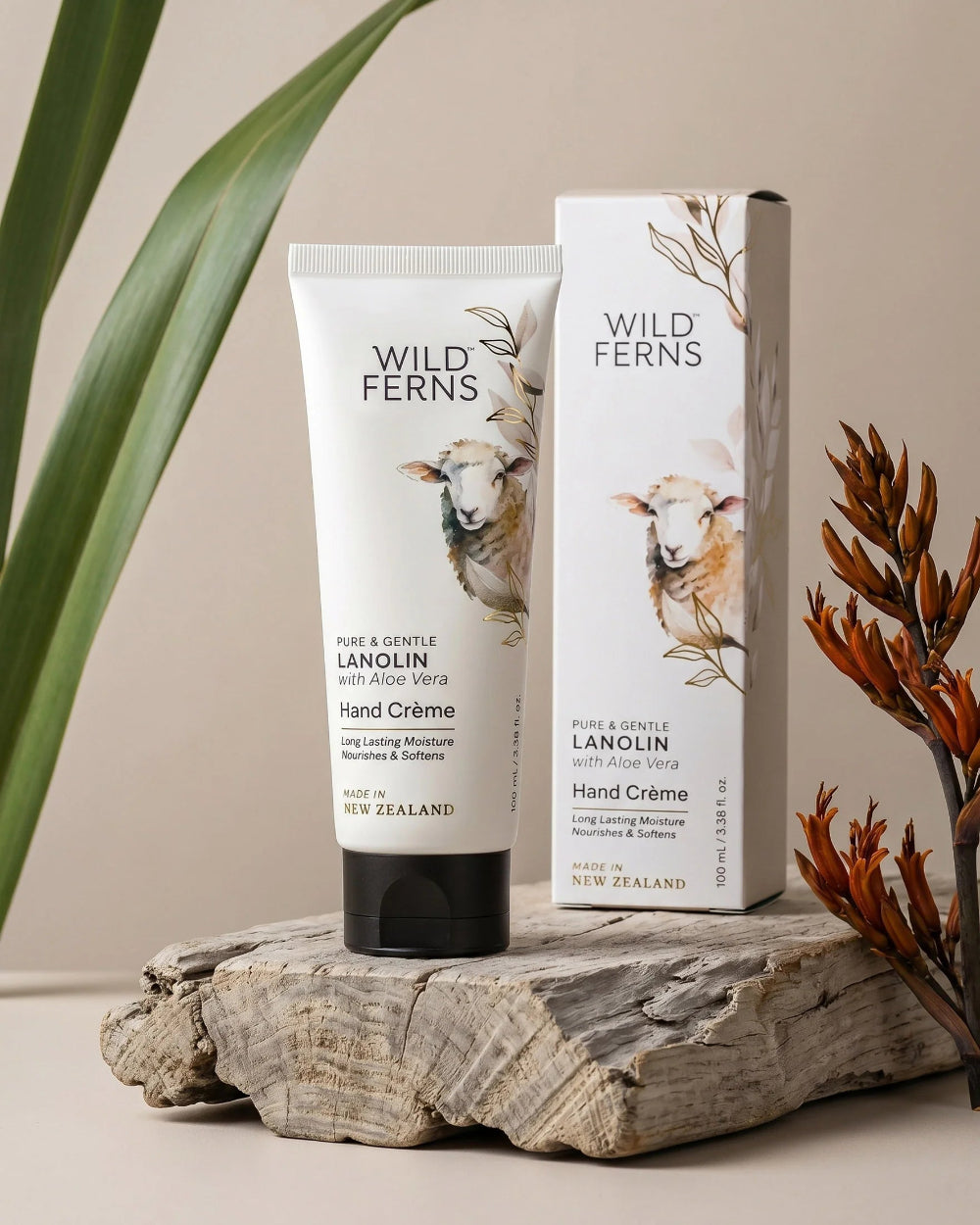 Wild Ferns hand cream and packaging on a wooden surface with plants in the background