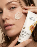 Person applying Wild Ferns Manuka Honey Facial Scrub to their face