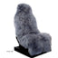 Grey sheepskin car seat cover on a white background