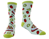A pair of crew socks with a light mint green base, featuring a repeating pattern of red strawberries, green kiwi slices, and red-and-white strawberry cake slices, with lime green heels, toes, and cuffs.