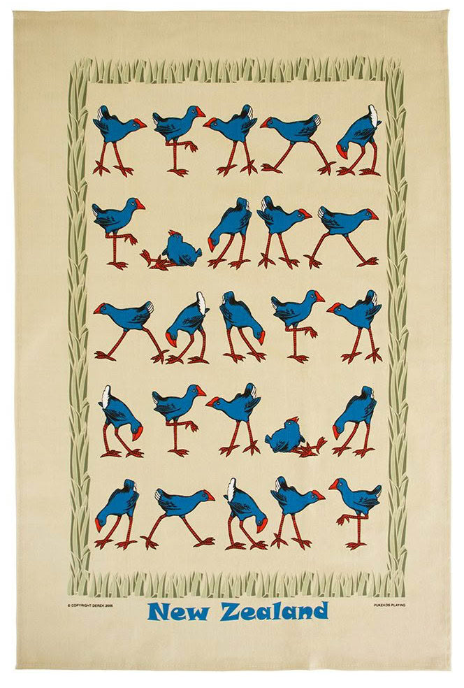 A vintage-style New Zealand tea towel featuring a cream-colored background with a border of green reeds and rows of blue birds with red beaks and legs. The words 'New Zealand' are printed in blue at the bottom. Main image