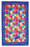A rectangular tea towel featuring a colorful pattern of cartoon kiwi birds in shades of yellow, blue, green, pink, and orange on a dark blue background, with 'Rainbow kiwis * New Zealand' printed along the borders.