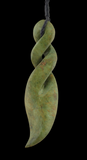 Green jade spiral pendant on a black background