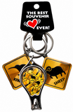 A souvenir keychain with a metal nail clipper in the center, two yellow warning-sign charms shaped like a kangaroo and a sheep, and a black hanging card that reads 'THE BEST Souvenir EVER!'.