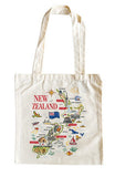 An off-white canvas tote bag featuring a colorful illustrated map of New Zealand with various landmarks, animals, and the text 'NEW ZEALAND' in red, shown against a plain white background.