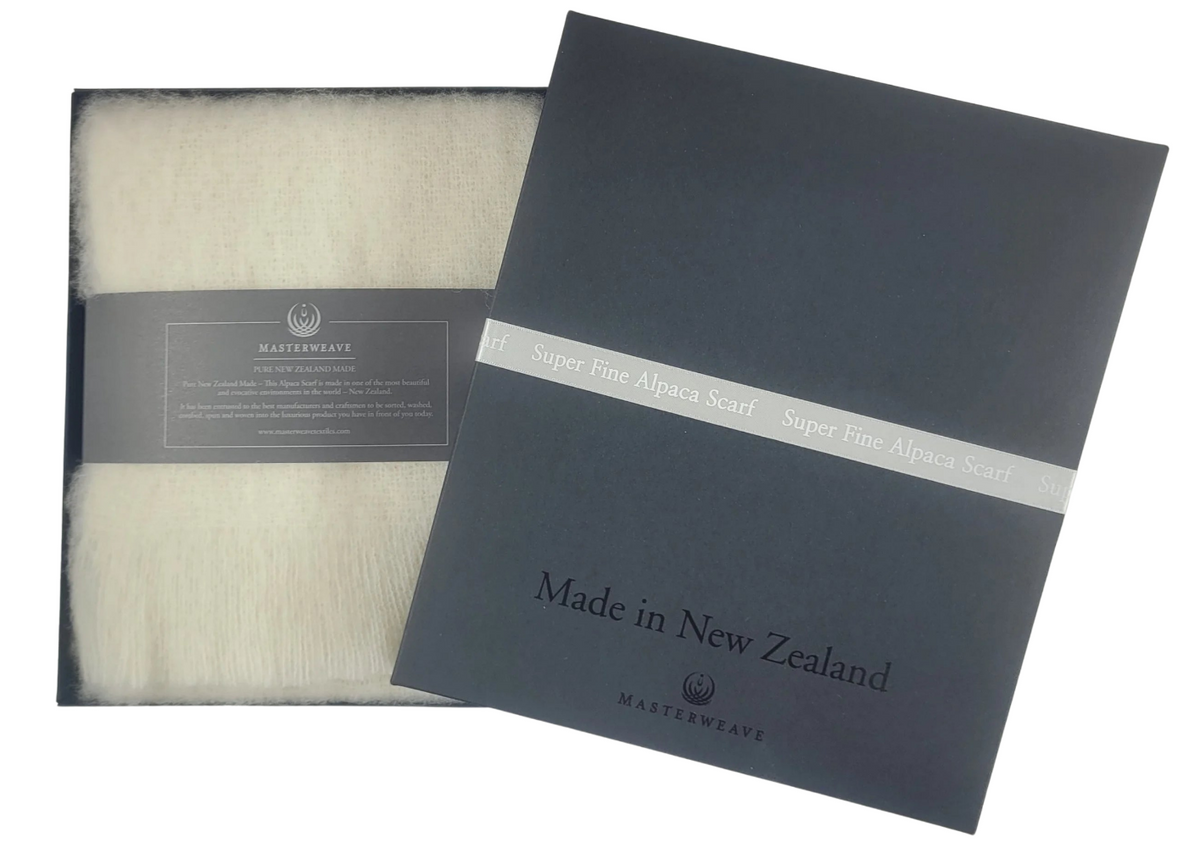 White scarf in a black box with 'Made in New Zealand' label Main image