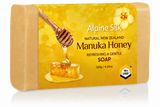 A rectangular bar of Alpine Silk Manuka Honey soap in a natural tan color, featuring a yellow label with a honey dipper, honeycomb, and a flower. The label reads 'Alpine Silk Natural New Zealand Manuka Honey Refreshing & Gentle SOAP 120g / 4.
