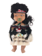 Doll with traditional attire and headdress on a white background