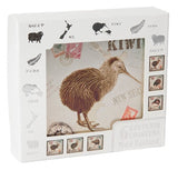 A white souvenir coaster box featuring a large illustration of a kiwi bird in the center, surrounded by small kiwi-themed postage stamp designs and country silhouettes on a clean white background.