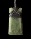 Green stone pendant with woven design on a black background