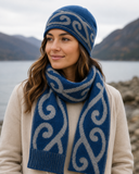 Lady wearing koru possum merino beanie and scarf with hills in the background
