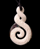 A carved white Maori-style pendant with a spiral motif and black cord, shown against a solid black background.