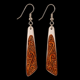 Bone earrings on a black background