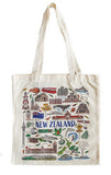 An off-white canvas tote bag featuring a colorful illustrated graphic of New Zealand landmarks, animals, and the text 'NEW ZEALAND' in blue, shown against a plain white background.