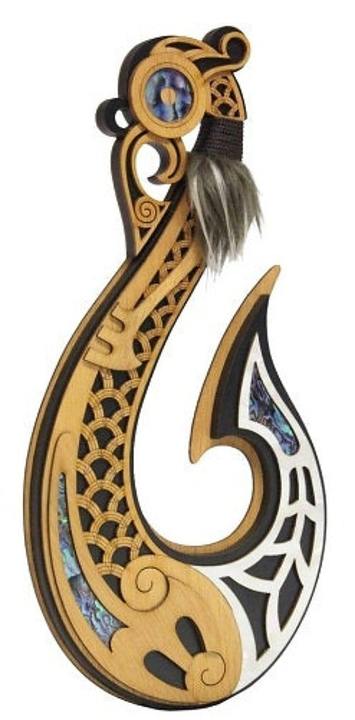 A carved wooden hook wall hanging or decorative hook with intricate black and white geometric inlay, blue mosaic accents, and a dark gray hanging cord with a feather, shown on a plain white background. Main image