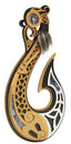 A carved wooden hook wall hanging or decorative hook with intricate black and white geometric inlay, blue mosaic accents, and a dark gray hanging cord with a feather, shown on a plain white background.