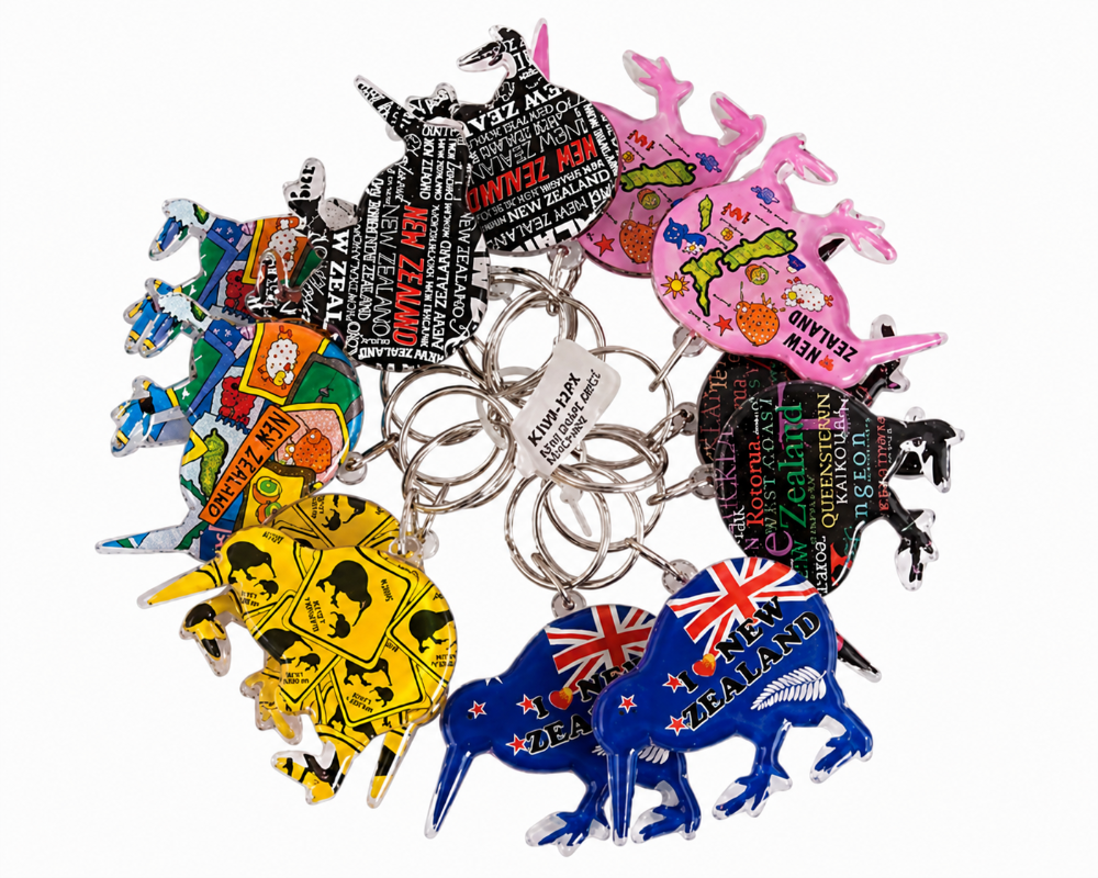 A set of colorful New Zealand-themed keychains featuring kiwi birds, each decorated with unique illustrations, text, and flags, arranged on a plain white background. Main image