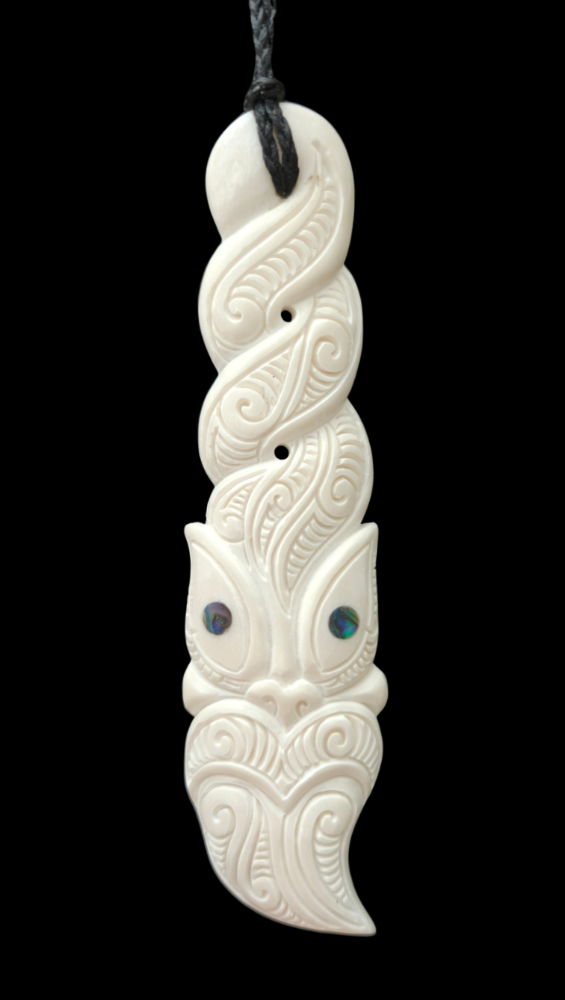 White carvings with blue stones on a black background Main image