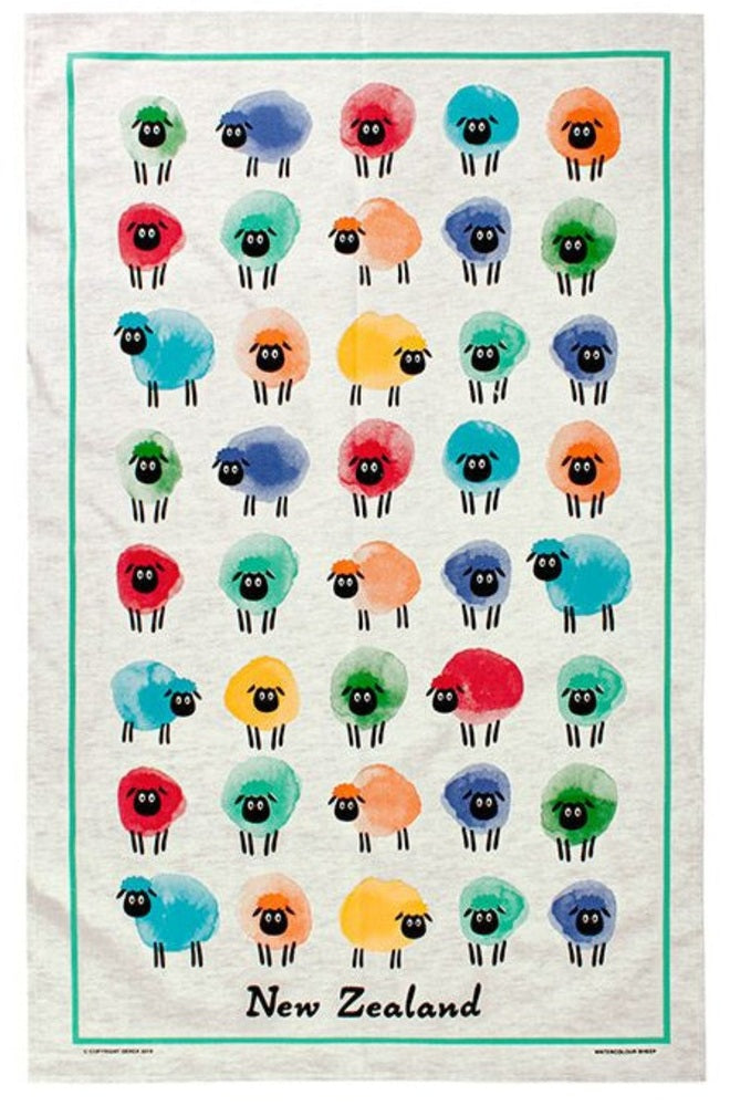 A white tea towel featuring a grid of colorful, hand-drawn sheep illustrations in red, blue, green, yellow, orange, and purple, framed by a teal border with 'New Zealand' printed at the bottom.