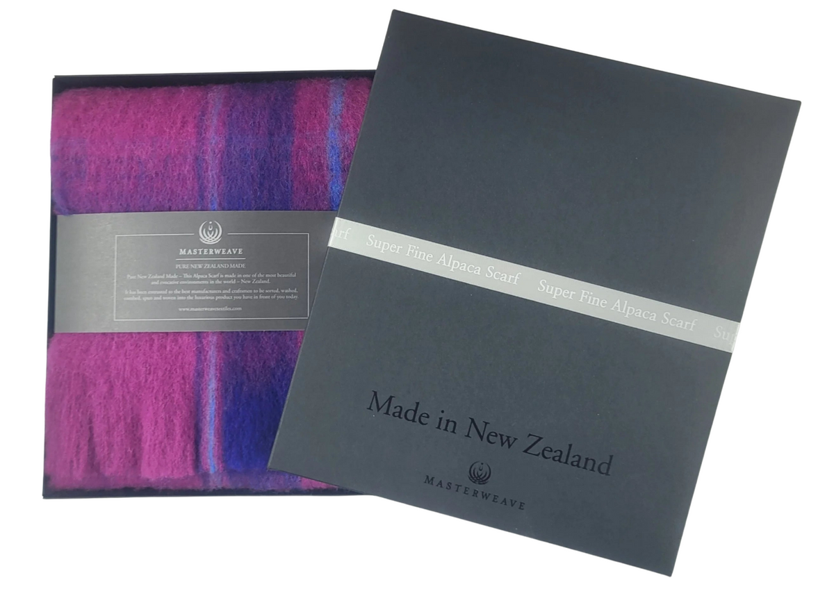 Purple scarf with packaging and 'Made in New Zealand' label on a white background