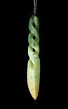Green jade pendant with a twisted design on a black background