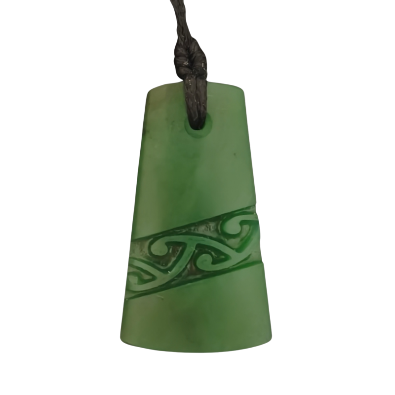 Green pendant with intricate design on a white background